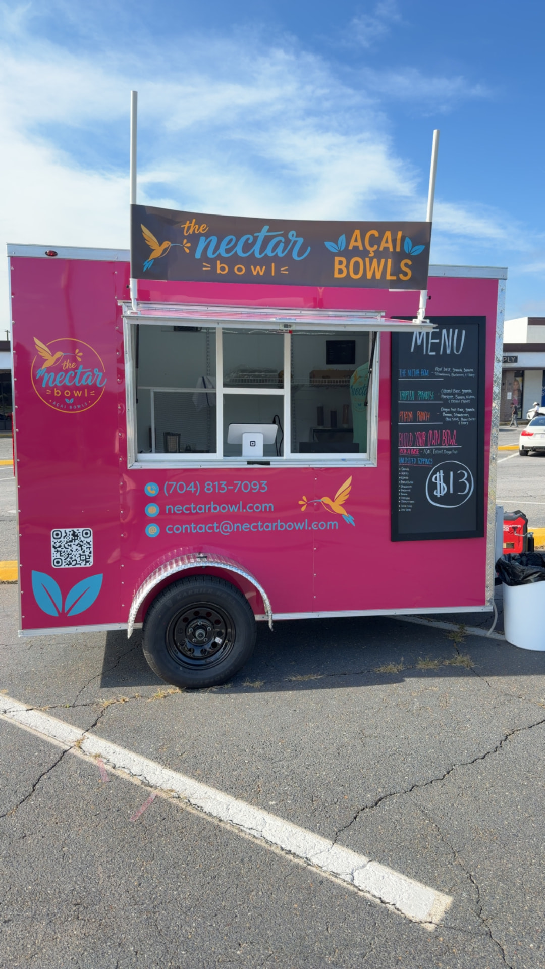 The Nectar Bowl pink açaí trailer parked in Kings Mountain, NC with its menu board